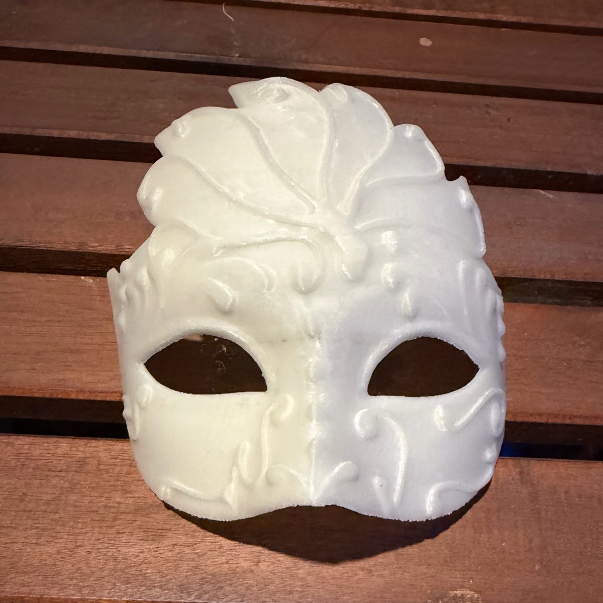 White 3D printed masquerade mask with raised swirl and leaf detail