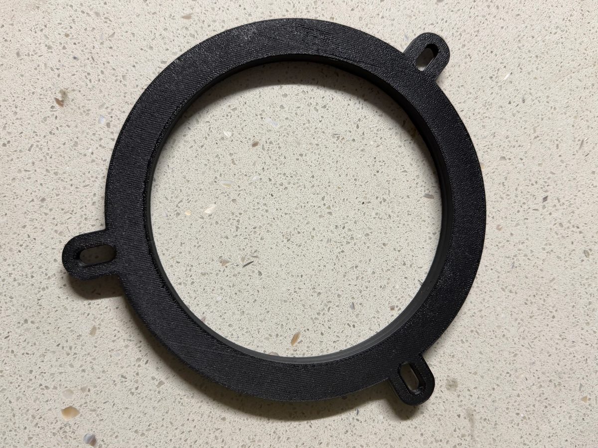 Black 3D printed custom mounting ring bracket with screw tabs
